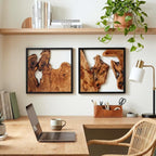 Design reference: Two framed wood sculptures arranged above a desk.