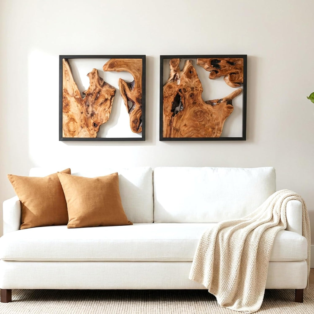 Design reference: Two framed wood sculptures above a living-room sofa.