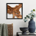 Design reference: One teak wall sculpture in a black frame above a console.