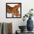 Design reference: One teak wall sculpture in a black frame above a console.