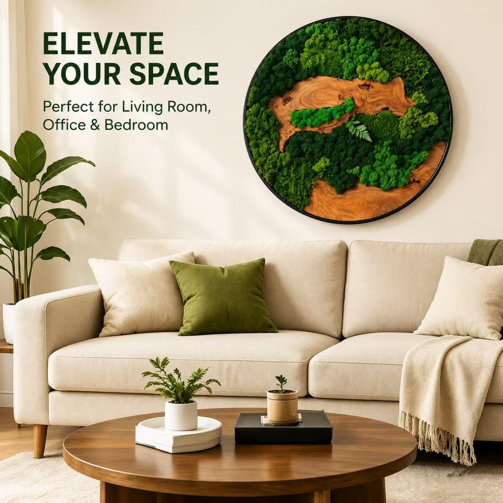 A circular wall art piece featuring preserved green moss and natural wood grain textures within a black frame. The text "ELEVATE YOUR SPACE" and "Perfect for Living Room, Office & Bedroom" is printed in dark green on the wall.