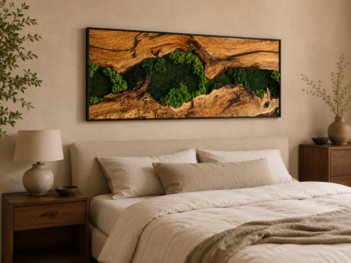 A rectangular wall art piece featuring a natural wood frame with a prominent, textured grain pattern. The center of the wood is split, revealing clusters of vibrant green preserved moss nestled within the deep, organic crevices.