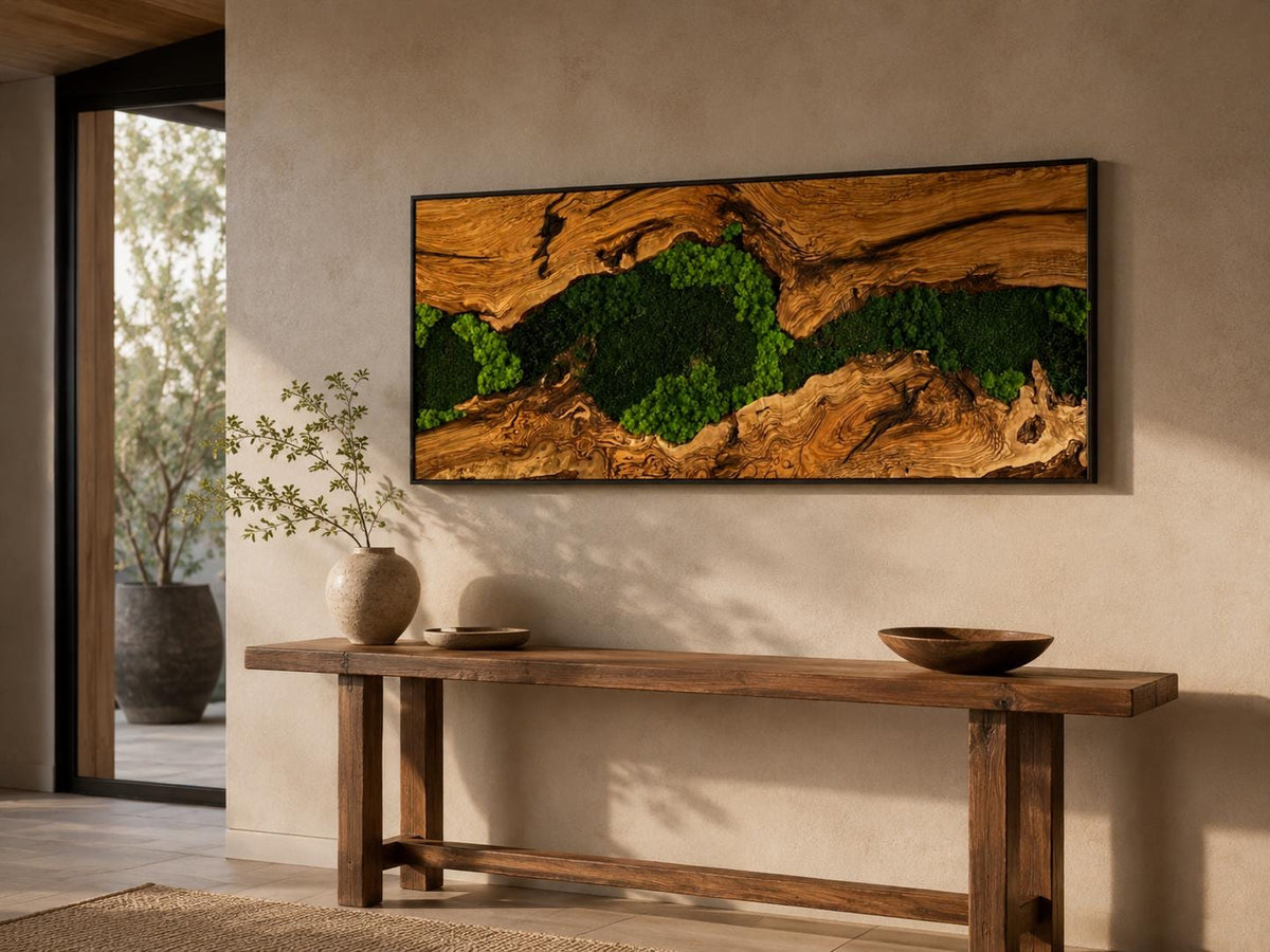 A rectangular wall art piece featuring a central channel of vibrant green preserved moss nestled between two pieces of textured, natural brown wood grain, all enclosed within a thin, dark, minimalist rectangular frame.