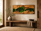 A rectangular wall art piece featuring a natural wood frame with a central horizontal crevice filled with vibrant green preserved moss. The wood displays a textured, weathered grain pattern in shades of light and dark brown.