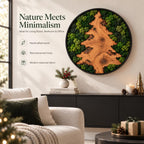 A circular wall art piece featuring a natural wood grain tree silhouette surrounded by green preserved moss in a black frame. Text on the wall reads Nature Meets Minimalism, Handcrafted wood, Real preserved moss, Modern seasonal décor.