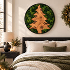 A circular wall art piece featuring a natural wood slice shaped like a pine tree, surrounded by preserved green moss within a black frame. The wood grain is visible, showcasing organic textures and knots against the vibrant moss.