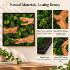 A square wall art piece featuring preserved green moss and natural wood grain elements encased in a slim black frame. The composition displays a layered 3D texture with organic wood shapes and various shades of green moss.