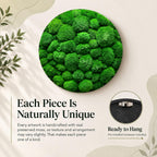 A circular wall art piece featuring dense, vibrant green preserved moss with a textured, rounded surface. A smaller inset shows the black circular frame from the back, including a pre-installed metal hanger for wall mounting.