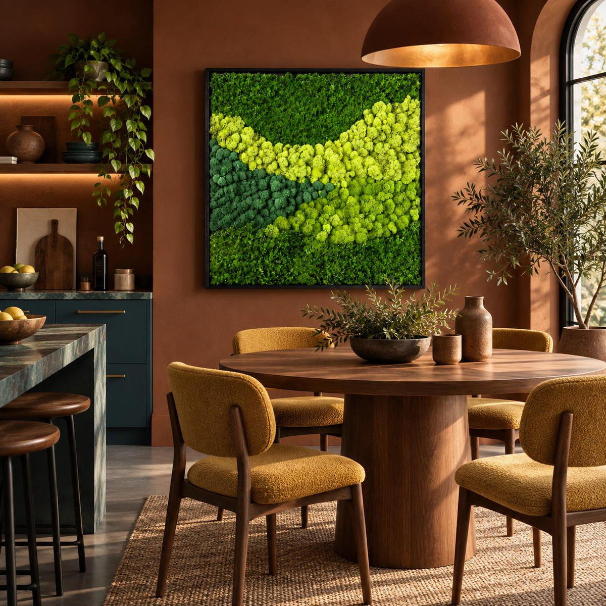 A square wall art piece featuring a dense arrangement of preserved moss in varying shades of vibrant lime, bright yellow-green, and deep forest green, framed in a thin black border and mounted on a solid terracotta-colored wall.