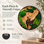 A circular wall art piece featuring a natural wood slice with prominent grain patterns, surrounded by various textures of preserved green moss and fern leaves, all enclosed in a thin black frame with pre-mounted hanging hardware.
