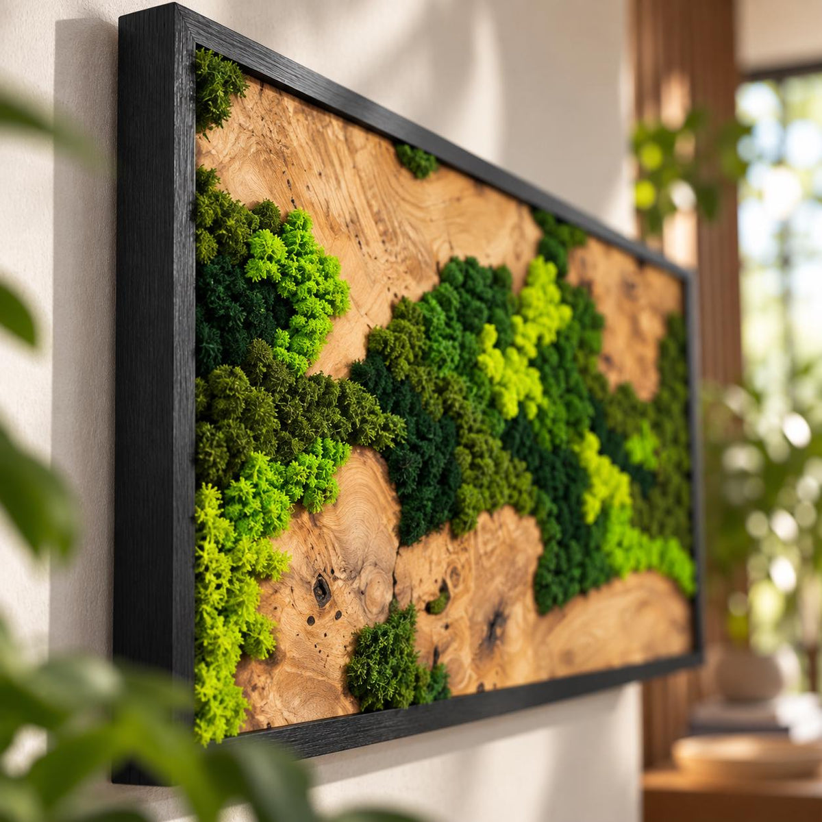 A rectangular wall art piece featuring a natural wood slab with a prominent grain and knots, accented by clusters of preserved moss in varying shades of bright lime, emerald, and dark forest green, all encased in a black frame.