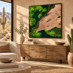 A square wall art piece featuring a natural wood grain panel contrasted with vibrant lime green and deep forest green preserved moss. The composition is framed in a thin black border, creating a textured, organic landscape display.